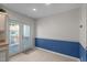 Kitchen dining area with blue striped wallpaper and door to deck at 6548 English Oaks Dr, Raleigh, NC 27615