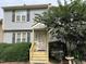 Two story home with gray siding and yellow steps at 6548 English Oaks Dr, Raleigh, NC 27615