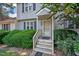 Front entrance with gray siding and wooden steps at 6548 English Oaks Dr, Raleigh, NC 27615