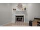 White tiled fireplace with decorative mantel at 6548 English Oaks Dr, Raleigh, NC 27615