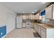 Kitchen with white appliances and tile flooring at 6548 English Oaks Dr, Raleigh, NC 27615