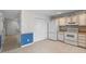 Kitchen with white appliances and tile flooring at 6548 English Oaks Dr, Raleigh, NC 27615