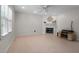 Living room with fireplace and built-in shelving at 6548 English Oaks Dr, Raleigh, NC 27615