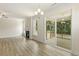 Spacious living area with hardwood floors, fireplace, and access to a deck at 72 Demascus Way, Four Oaks, NC 27524