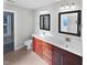 Bathroom with double vanity, neutral colored tile and a shower at 917 Palm Ct, Mebane, NC 27302