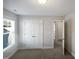 Bright bedroom with double doors and window at 917 Palm Ct, Mebane, NC 27302