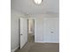 Spacious bedroom with double door closet and carpeting at 917 Palm Ct, Mebane, NC 27302