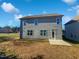Gray siding two story house with small patio and yard at 917 Palm Ct, Mebane, NC 27302