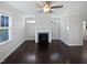 Living room with dark hardwood floors and a fireplace at 917 Palm Ct, Mebane, NC 27302