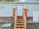Back exterior showcasing stairs to a wooden deck at 105 N Bend Dr, Knightdale, NC 27545