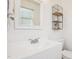 Simple bathroom with a single sink, toilet and decorative shelving at 105 N Bend Dr, Knightdale, NC 27545