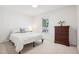 Well-lit bedroom with a double bed, dresser, and large window at 105 N Bend Dr, Knightdale, NC 27545