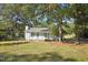 Charming one-story house with a well-manicured lawn and mature trees at 105 N Bend Dr, Knightdale, NC 27545