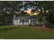 Inviting home with a well-maintained front yard, classic design, and eye-catching blue trim at 105 N Bend Dr, Knightdale, NC 27545