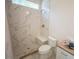 Bathroom features a tiled shower with a bench, a toilet, and a sink vanity at 1116 Delilia Ln, Wake Forest, NC 27587