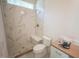 Modern bathroom with tiled shower, bench seating, and gold fixtures at 1116 Delilia Ln, Wake Forest, NC 27587