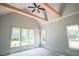 Bright bedroom with vaulted ceilings, wood beams, and large windows offering scenic views at 1116 Delilia Ln, Wake Forest, NC 27587