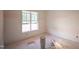 A well-lit bedroom with neutral walls, awaiting personalization, providing a blank canvas for new owners at 1116 Delilia Ln, Wake Forest, NC 27587