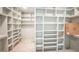 Spacious walk-in closet features custom shelving with plenty of room for organization at 1116 Delilia Ln, Wake Forest, NC 27587