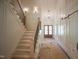 Elegant entryway with detailed trim work, wood stairs and a sliding barn door at 1116 Delilia Ln, Wake Forest, NC 27587