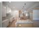 Spacious kitchen with white cabinets, a large island, and modern lighting fixtures at 1116 Delilia Ln, Wake Forest, NC 27587