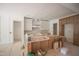 A spacious kitchen featuring custom wood cabinetry and island, awaiting finishing touches at 1116 Delilia Ln, Wake Forest, NC 27587