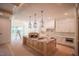 Bright kitchen with white cabinetry, an island with butcher block top, and modern appliances at 1116 Delilia Ln, Wake Forest, NC 27587