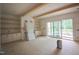 A spacious living room, with built-in shelves and sliding glass doors leading to the backyard at 1116 Delilia Ln, Wake Forest, NC 27587
