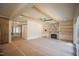 Spacious living room with a stone fireplace, wood beams, and open layout at 1116 Delilia Ln, Wake Forest, NC 27587