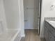 Bathroom with tub, double vanity, and granite countertop at 16 Holly Grove Ln, Lillington, NC 27546