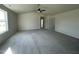 Spacious main bedroom with ceiling fan and carpet at 16 Holly Grove Ln, Lillington, NC 27546