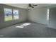 Spacious bedroom with new carpet and large windows at 16 Holly Grove Ln, Lillington, NC 27546