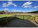 Deck overlooking grassy backyard and distant trees at 16 Holly Grove Ln, Lillington, NC 27546