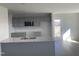 Modern kitchen with gray cabinets and granite countertops at 16 Holly Grove Ln, Lillington, NC 27546