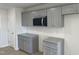 Modern kitchen with gray cabinets and granite countertops at 16 Holly Grove Ln, Lillington, NC 27546