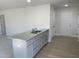 Modern kitchen island with granite and gray cabinets at 16 Holly Grove Ln, Lillington, NC 27546