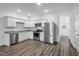 Spacious living room with wood-look flooring and open concept layout at 2052 Glen Crossing Dr, Durham, NC 27704