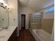 Updated bathroom with double vanity and glass block shower at 2106 Pathway Dr, Chapel Hill, NC 27516