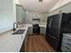 Modern kitchen with stainless steel appliances and quartz countertops at 2106 Pathway Dr, Chapel Hill, NC 27516