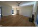 Hardwood floor living room with fireplace and ceiling fan at 2106 Pathway Dr, Chapel Hill, NC 27516