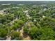 Lush, green neighborhood with homes nestled among mature trees, offering a serene and private setting at 2612 Ashe St, Durham, NC 27703
