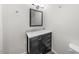 Contemporary bathroom with a marble countertop, vanity, and an elegant mirror at 2612 Ashe St, Durham, NC 27703