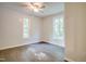 Bedroom with two large windows, offering ample natural light and hardwood floors at 2612 Ashe St, Durham, NC 27703