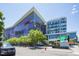 Daytime shot of an urban building with glass windows, trees, and signage at 2612 Ashe St, Durham, NC 27703