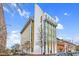 Modern building with gold accents on a bright, sunny day, showcasing the architectural details at 2612 Ashe St, Durham, NC 27703