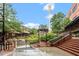 Daytime exterior featuring red brick buildings, stairs, greenery, water feature and the Lucky Strike water tower at 2612 Ashe St, Durham, NC 27703