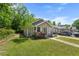 Charming single-story home with a well-manicured lawn and vibrant rose bushes enhancing curb appeal at 2612 Ashe St, Durham, NC 27703