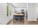 Bright kitchen featuring stainless steel appliances and an island with seating at 2612 Ashe St, Durham, NC 27703