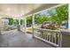 Inviting front porch with white railings and ample space to relax and enjoy the neighborhood view at 2612 Ashe St, Durham, NC 27703