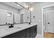 Elegant bathroom featuring a double vanity with large stylish mirrors and lighting at 2662 Sledge Rd, Louisburg, NC 27549